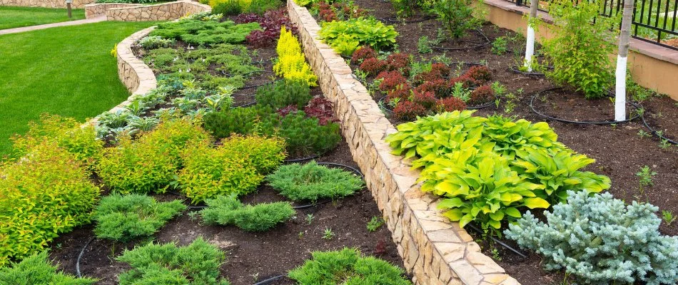 Layered retaining walls in Bristow, VA, with planter beds.