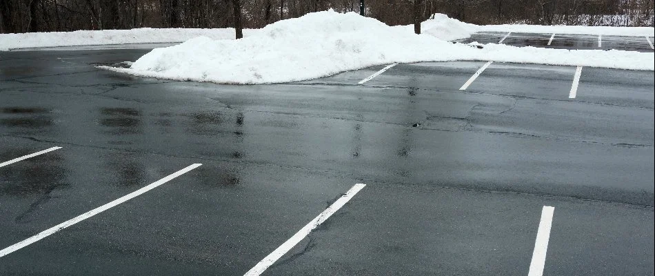 Snow pushed to the side of a parking lot in Bristow, VA.